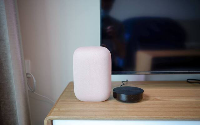 Google smart speaker beside an Aqara hub in a Singapore smart home