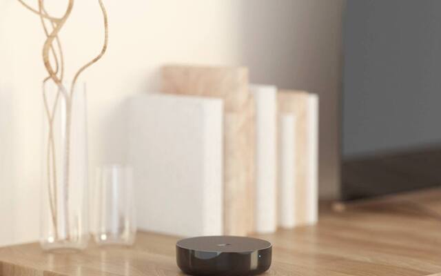 Aqara Hub M2 positioned in a room to send infrared commands to an air-conditioner