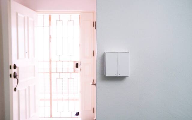 Wall switches installed beside the entrance of a Singapore home