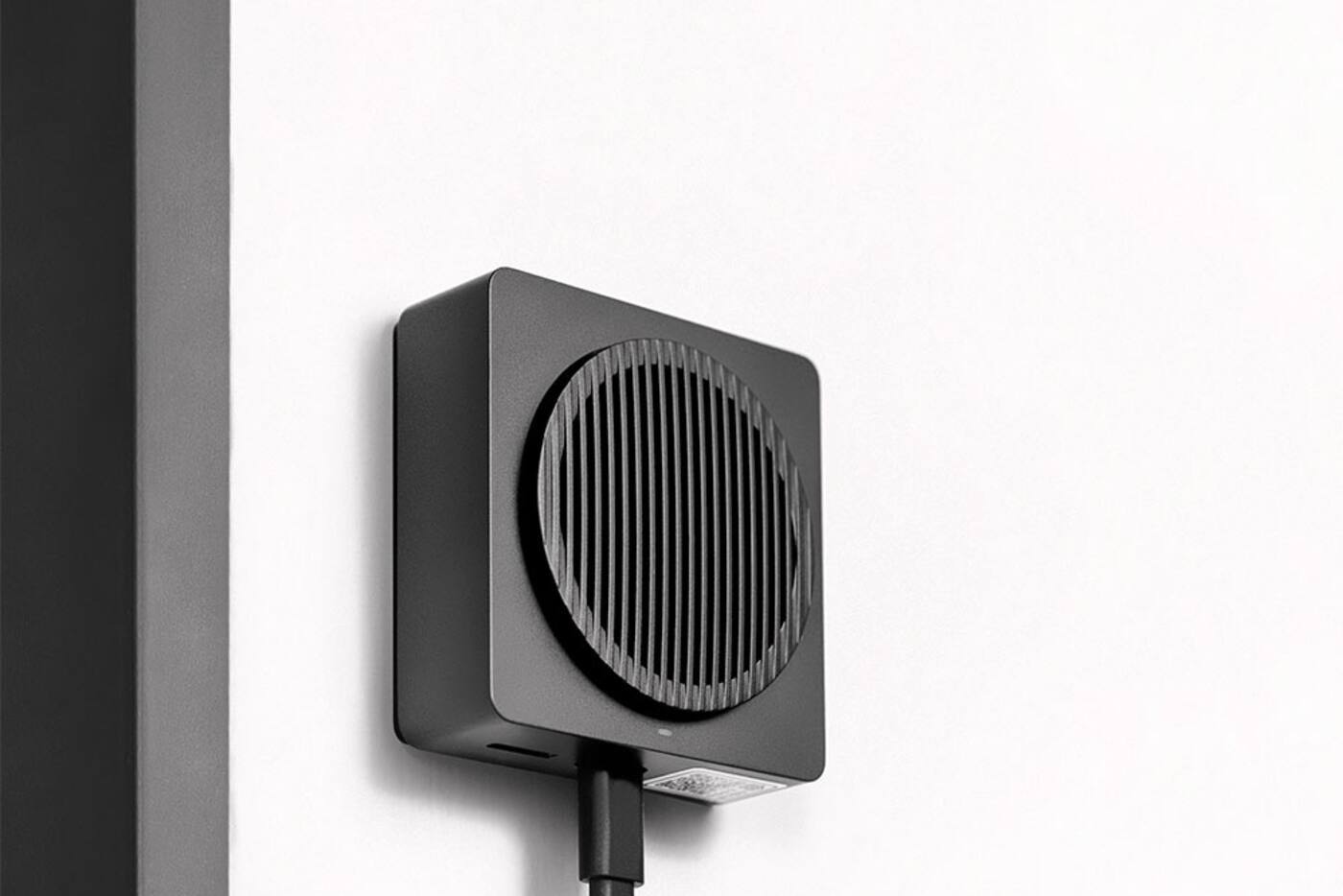Black Aqara G4 indoor chime repeater mounted on a wall and powered by a USB cable