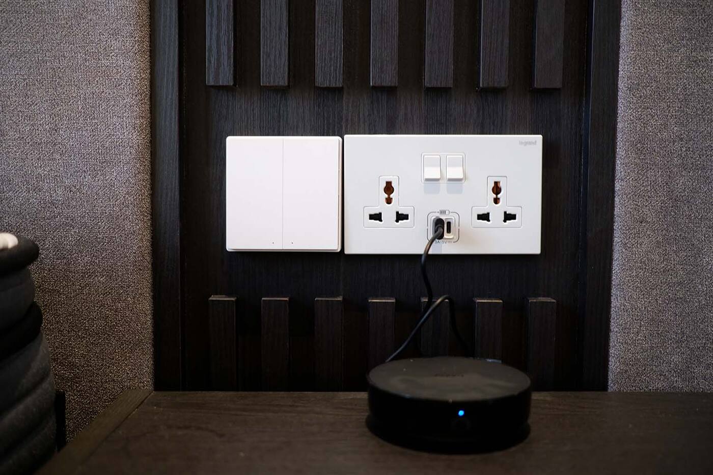 Aqara hub installed in an open position beside wall power