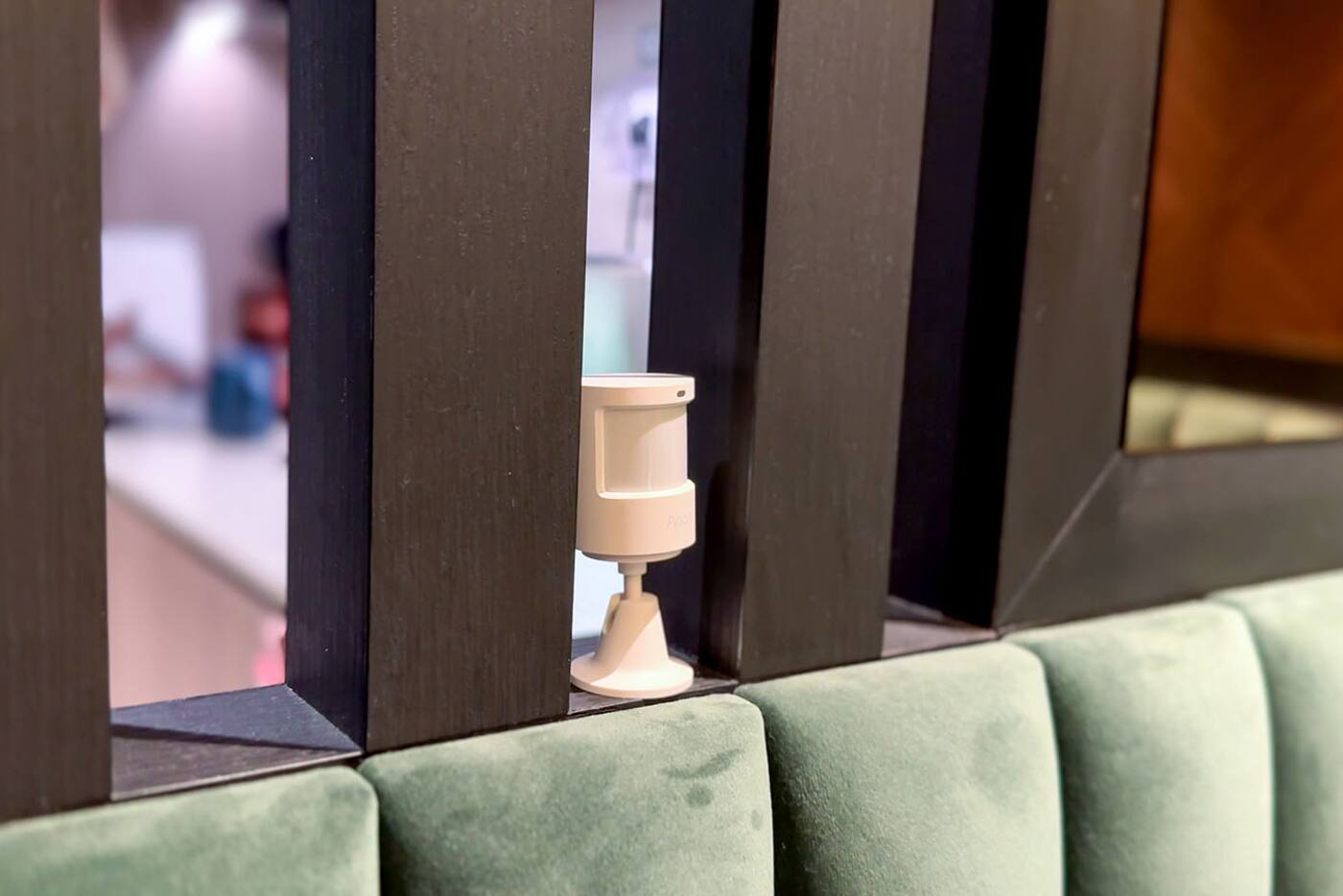 Aqara motion sensor positioned to watch movement through a living area
