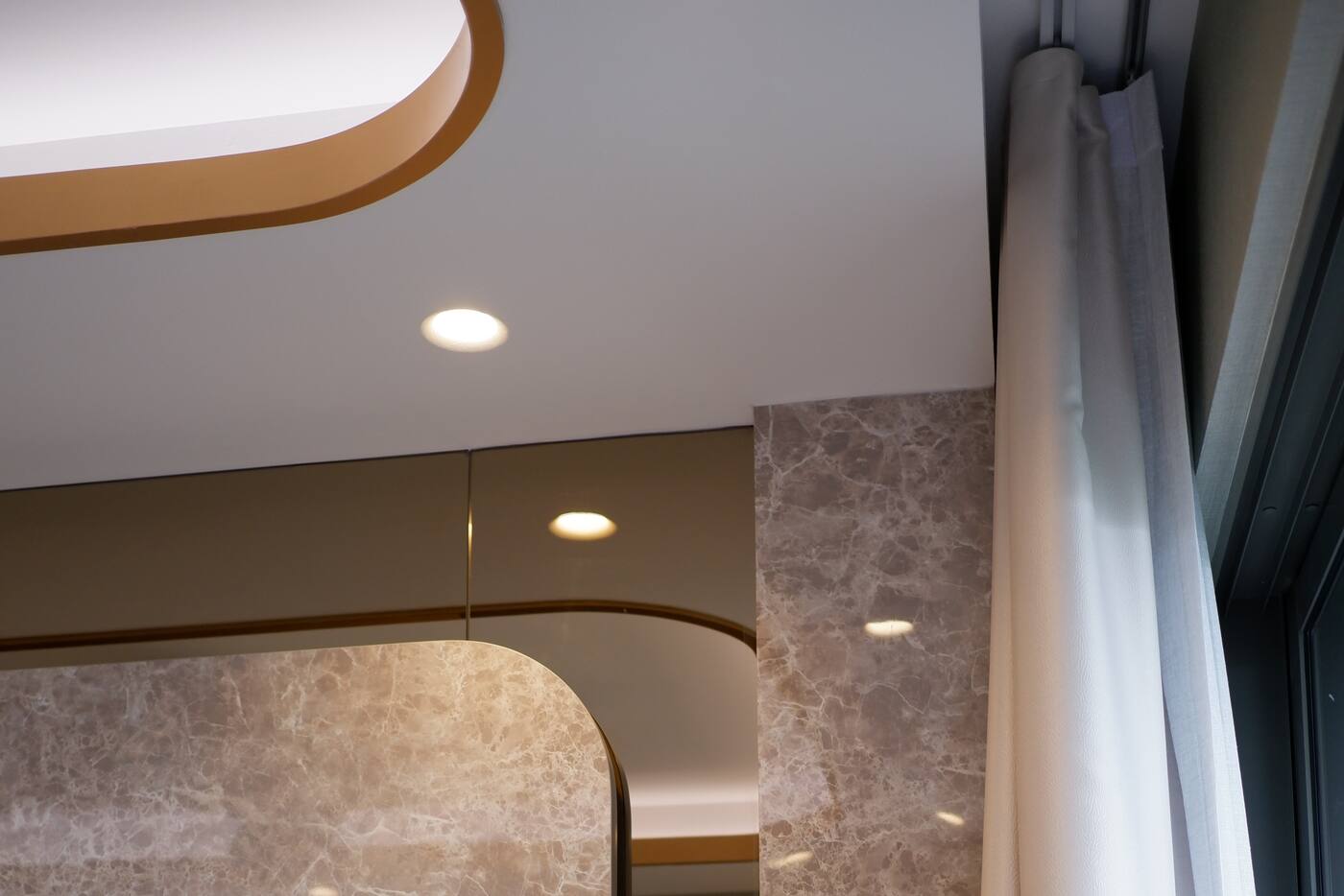 Full-height curtain stack concealing the motor at the end of a recessed track