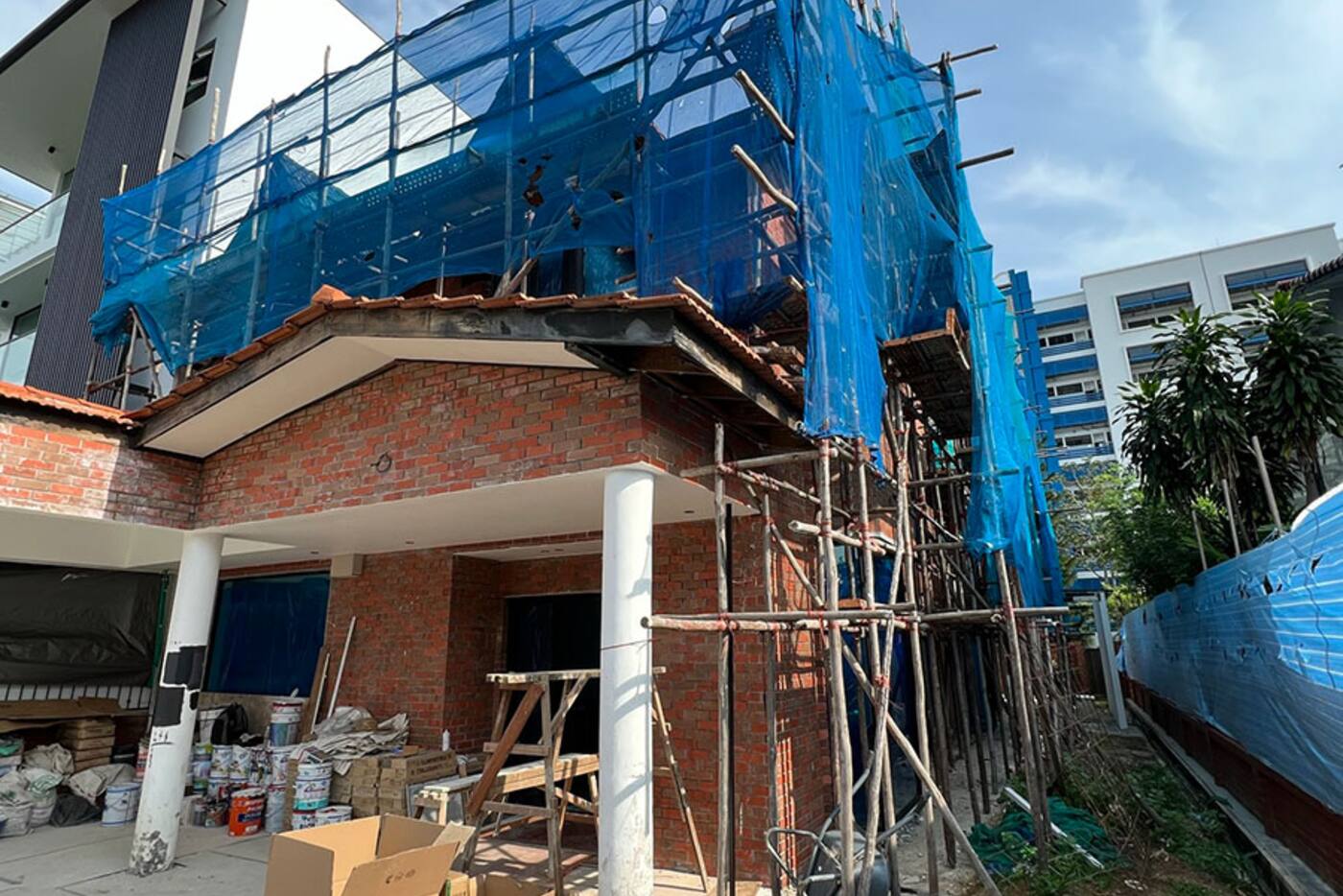 Singapore house undergoing renovation with scaffolding and unfinished services