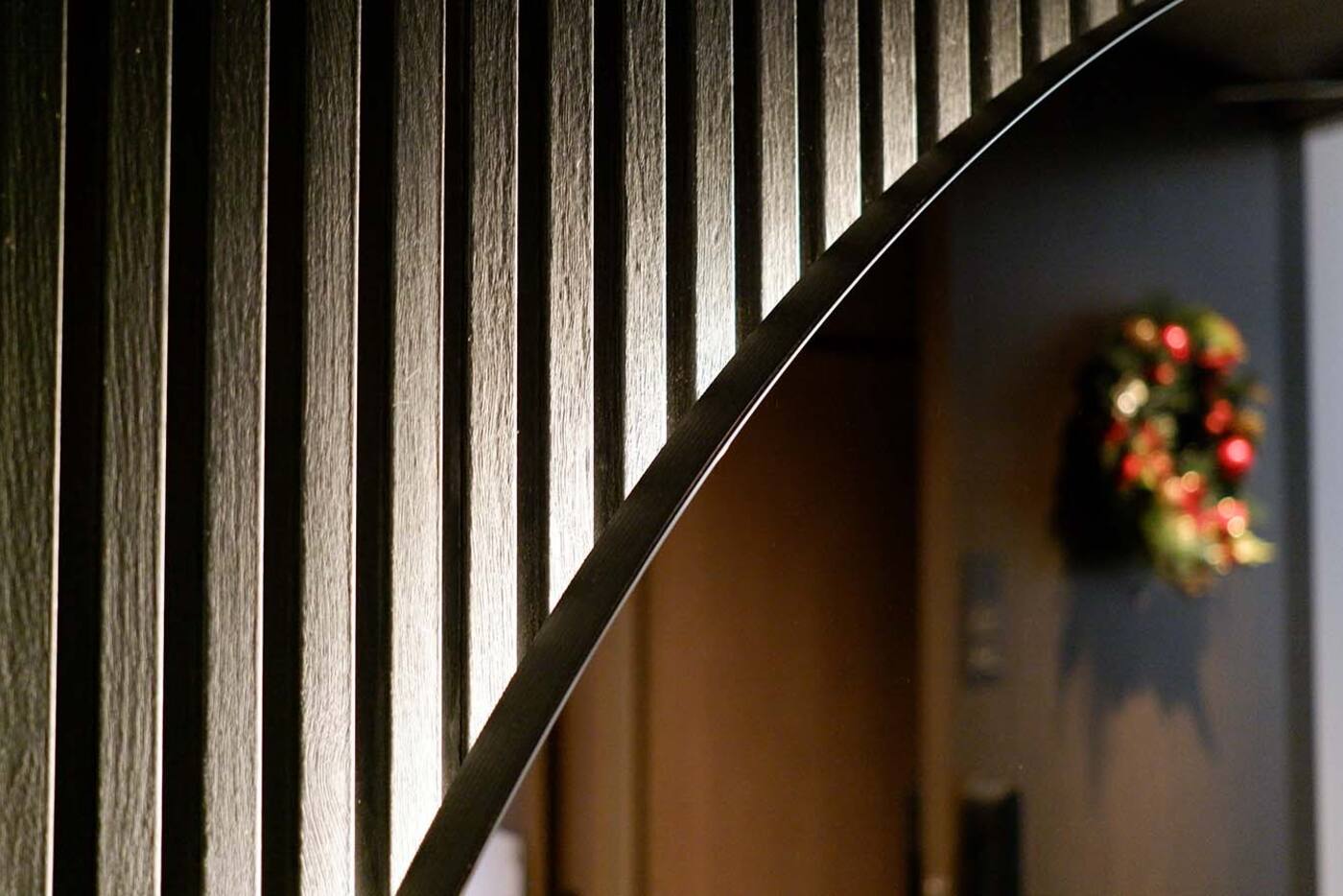 Concealed LED strip creating accent light along a timber feature wall