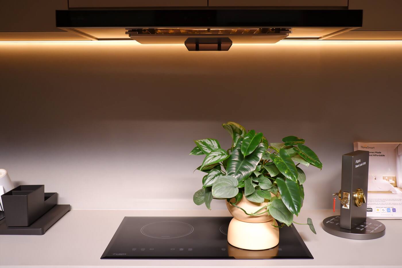 Warm concealed lighting illuminating a Singapore kitchen in the evening