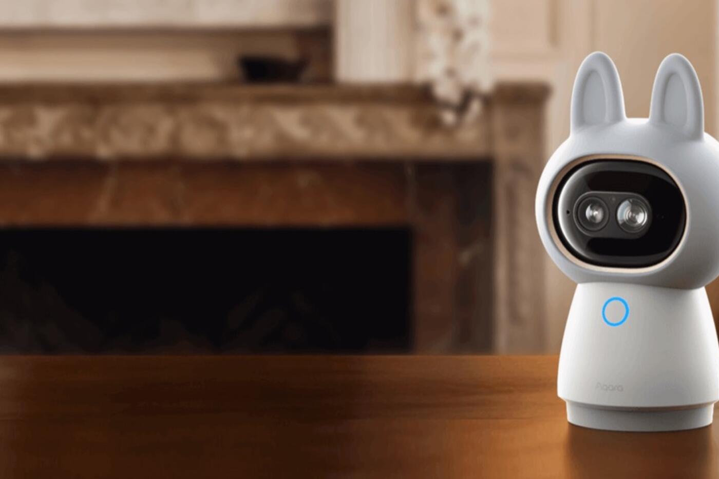 Aqara Camera Hub G350 positioned on a table inside a living room