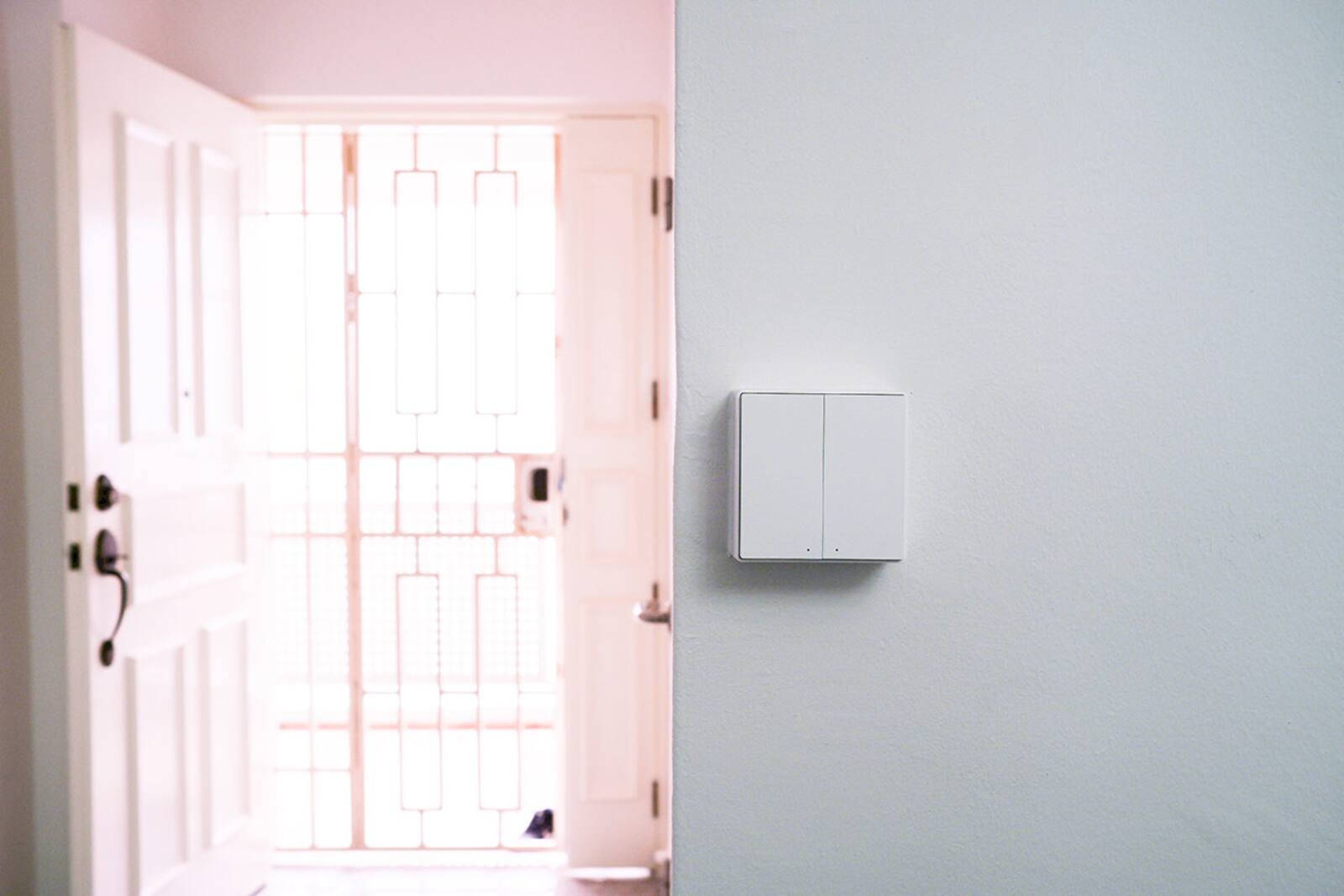 Wall switches installed beside the entrance of a Singapore home