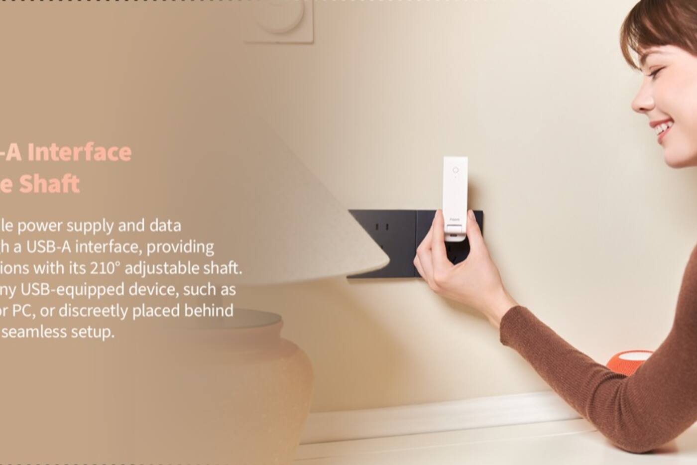 Compact Aqara hub plugged into an exposed wall socket instead of being enclosed in a cabinet