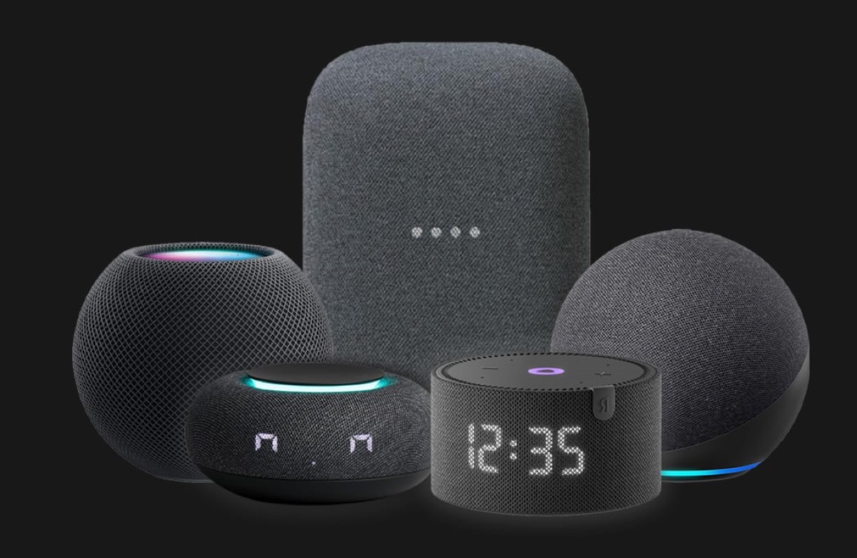 Apple HomePod mini, Google Nest and Amazon Echo smart speakers against a dark backdrop