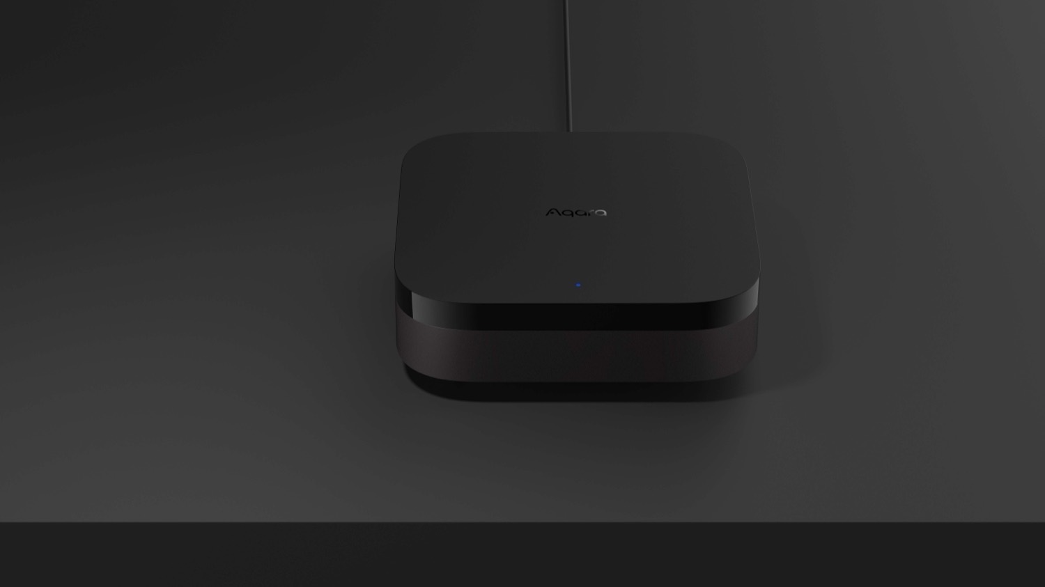 Aqara Hub M3 front-on, floating against a dark studio background