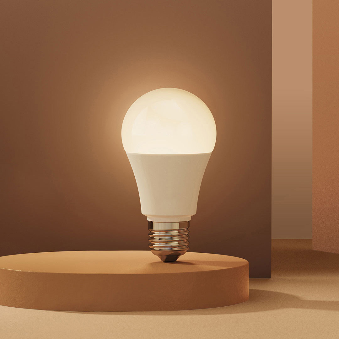 LED Bulb T2 glowing a warm E27 bulb on a display podium