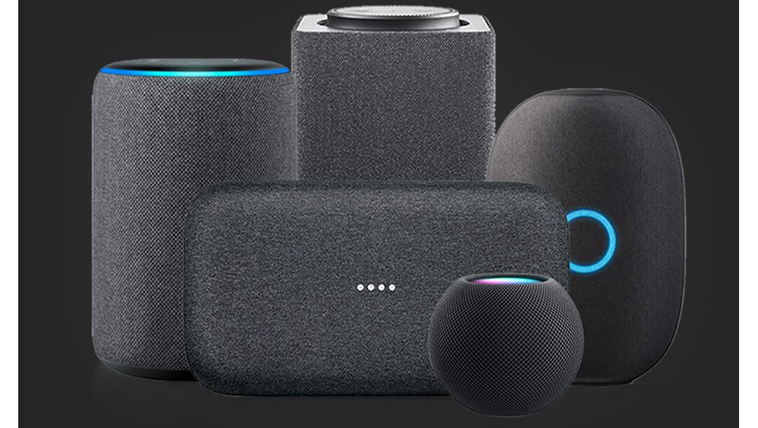 A cluster of smart speakers on a dark background representing supported voice ecosystems
