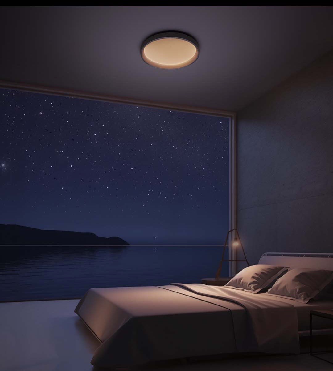 Ceiling Light T1M dimmed to a soft warm glow in a bedroom with a starry night view