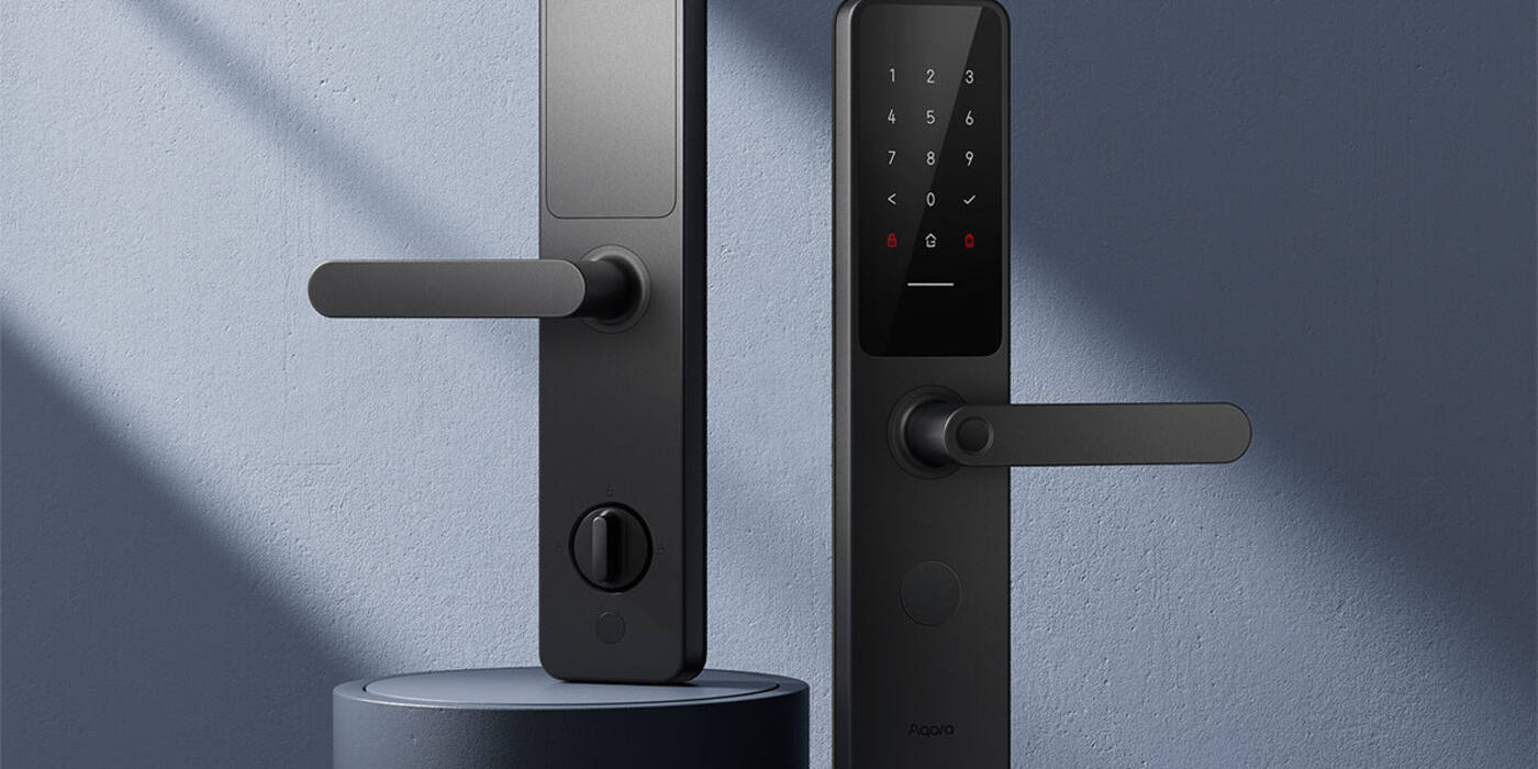 Aqara Smart Door Lock A100 front and rear plates against a blue wall in raking light