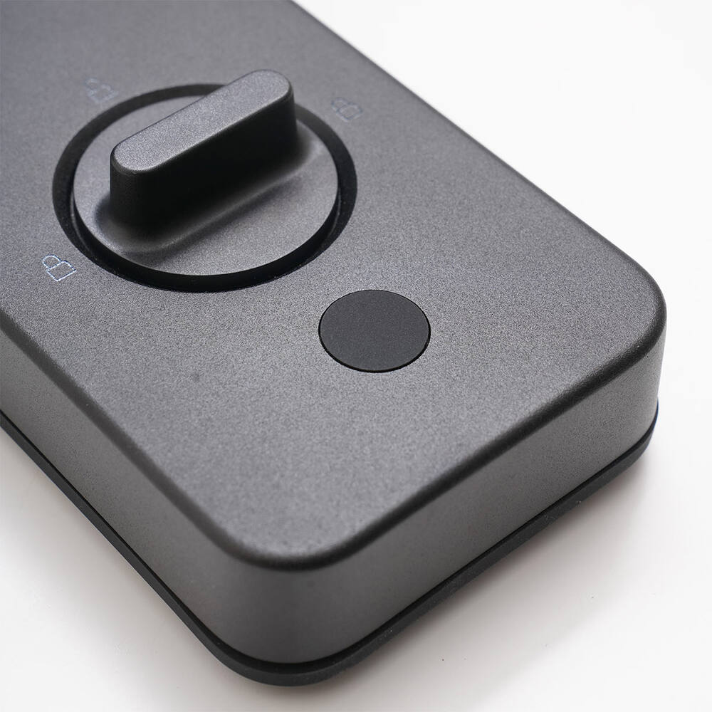 Macro of the A100's inside night-latch knob and separate Away Mode button