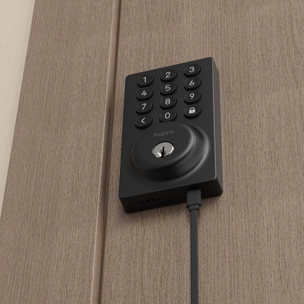 The Aqara Smart Lock B50 with a USB-C cable plugged into its emergency charging port