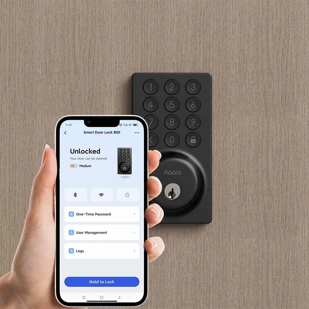 A hand holding a phone showing the Aqara Home app beside the B50 lock, unlocking the door remotely