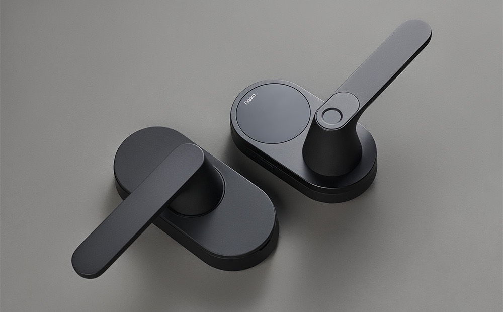 Aqara Smart Lock U300 in matte black, two lever panels on a grey surface