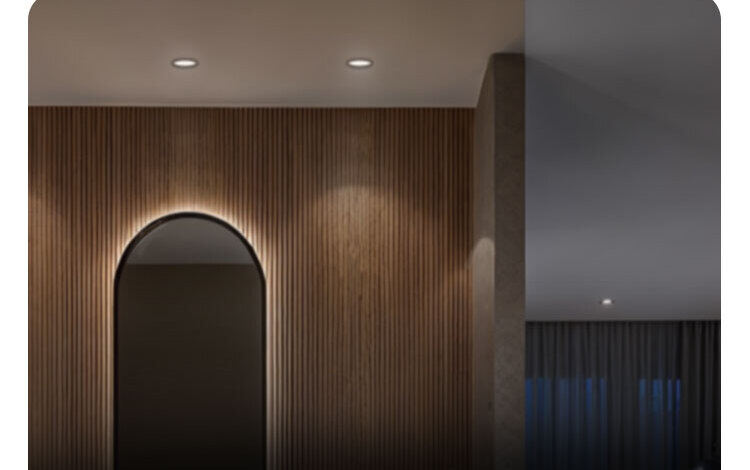 T2 Lite recessed downlights washing a wood-slat feature wall in warm light