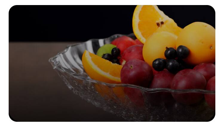 A glass bowl of fruit lit by the T2 Pro, showing true, saturated colour