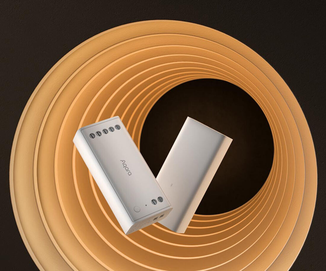 Two Aqara LED Strip Smart Modules resting on a warm concentric light-ring backdrop