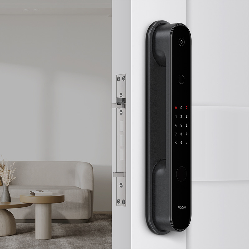 Aqara Smart Door Lock D100 fitted to a white modern door with a living room behind