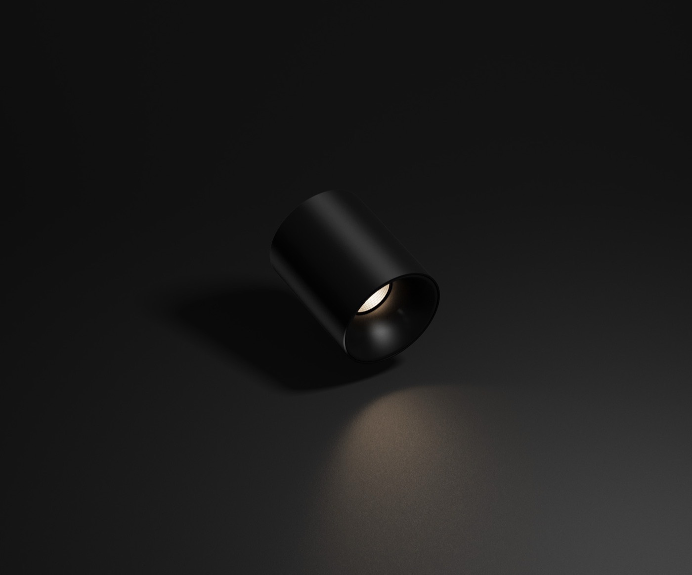 Black Spotlight T1 casting a warm, natural pool of light on a dark surface