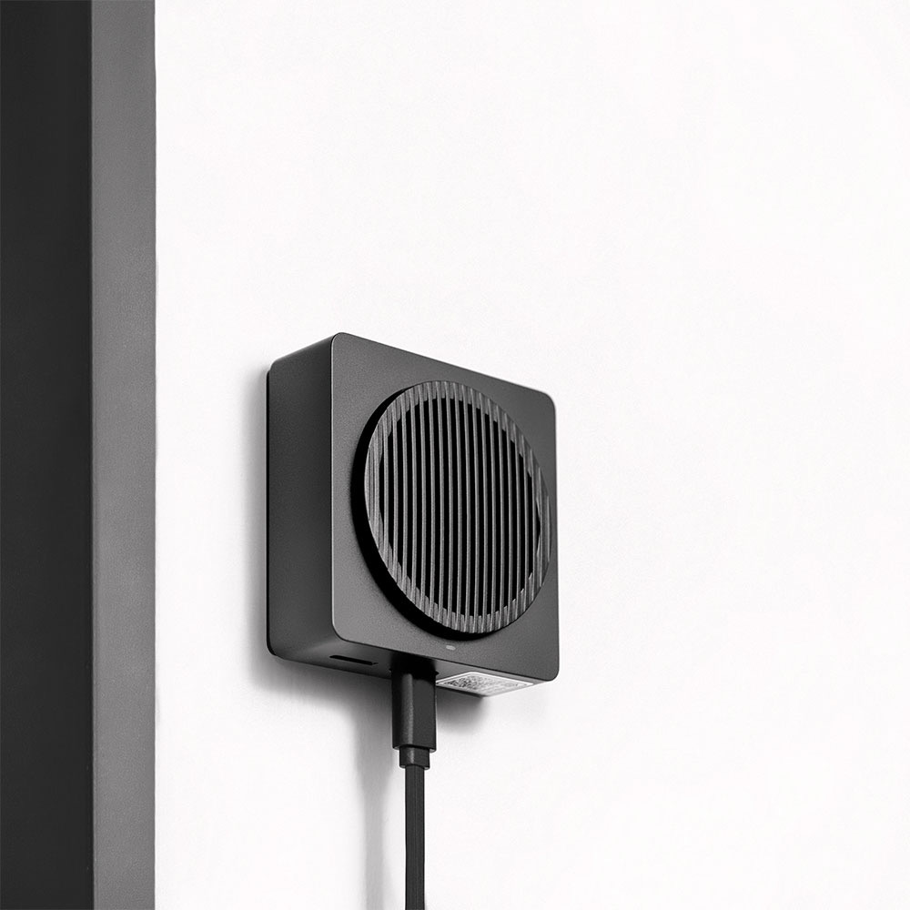 The Aqara G4 Chime Repeater mounted on an indoor wall with a USB-C cable