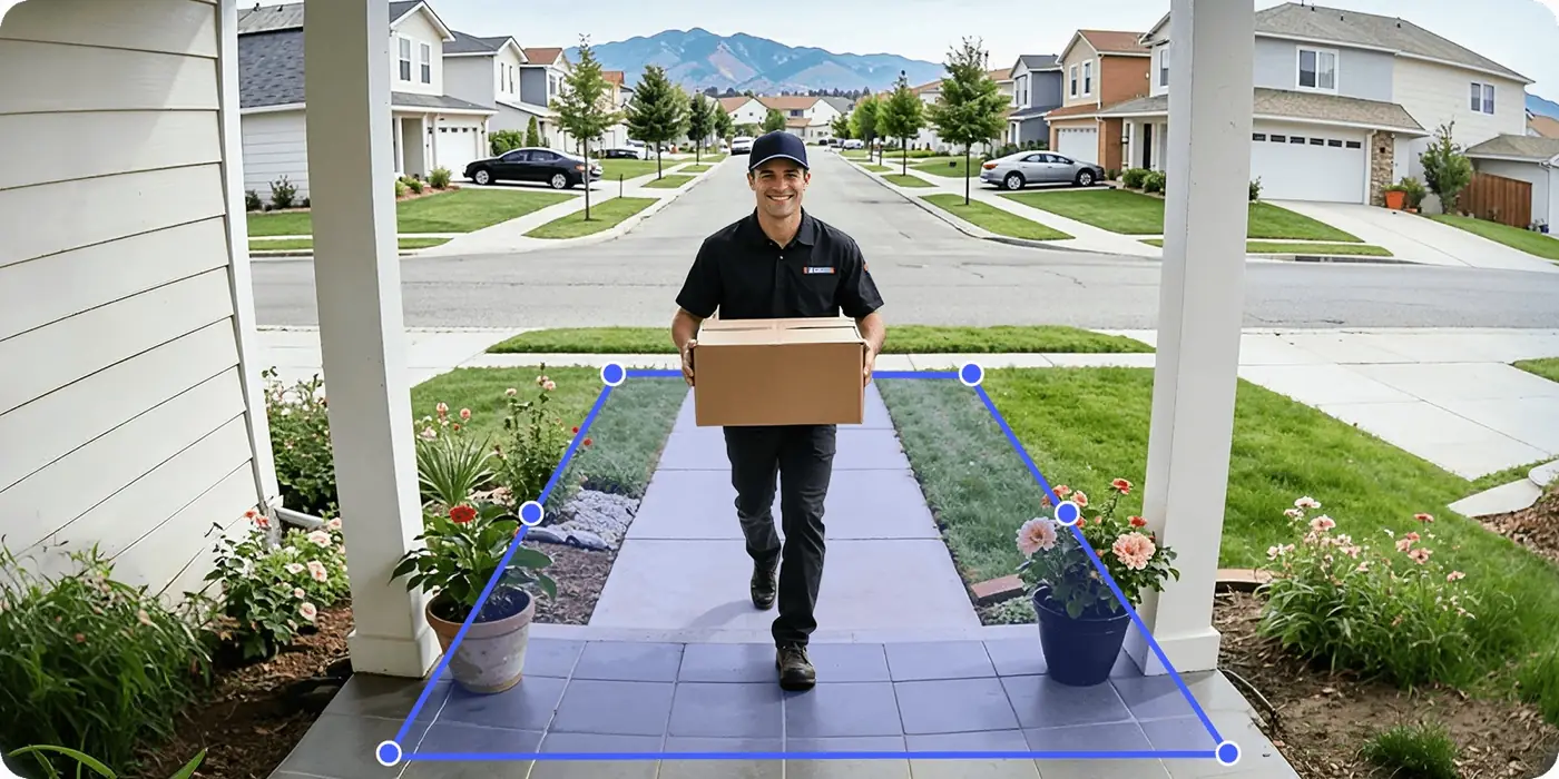 Doorbell view of a delivery courier walking up the path, with a custom detection zone drawn on the walkway