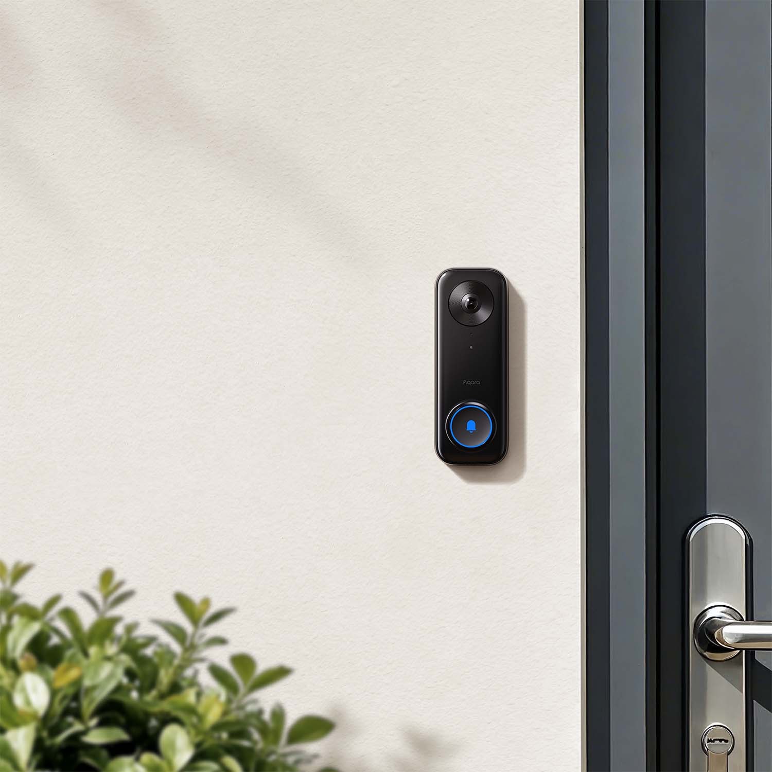 Aqara Smart Video Doorbell G400 mounted beside a modern glass front door