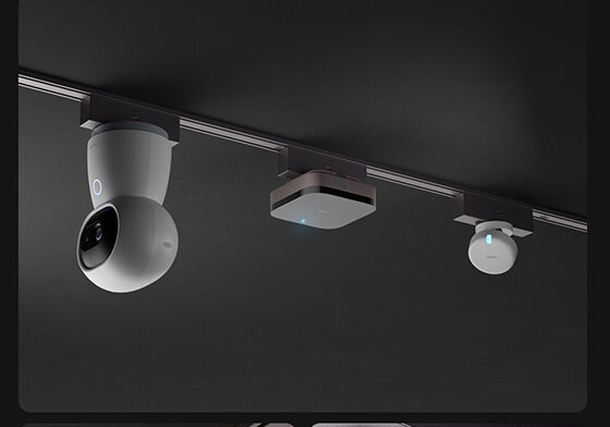 An Aqara camera, hub and sensor clipped directly onto the magnetic track