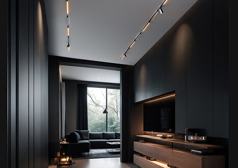 A continuous line of Aqara track lighting running from a hallway into a dark, warmly lit living room